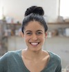 Portrait of a young woman smiling after a free consultation with a local injury attorney.